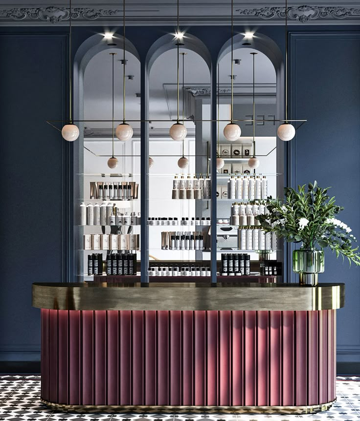 the interior of a restaurant with blue walls and gold trimmings on the counter