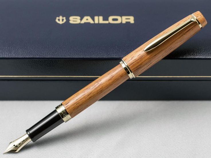 a wooden pen sitting on top of a box