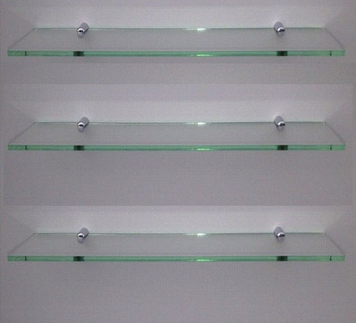 three glass shelves with chrome handles on each shelf