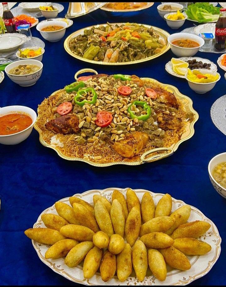 a table filled with plates and bowls full of food