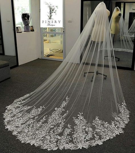 a white wedding veil with flowers on it