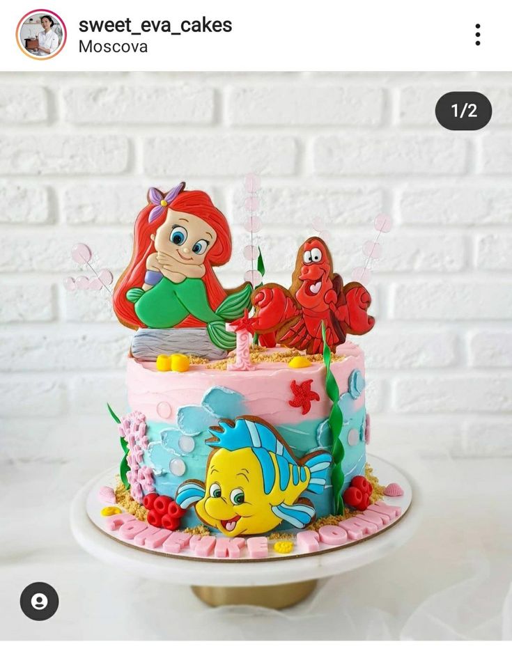 the little mermaid birthday cake is decorated with fondant and edible characters from disney's animated movie