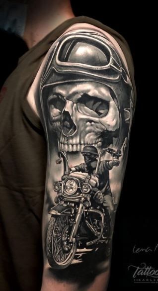 a man with a skull and motorcycle helmet on his arm