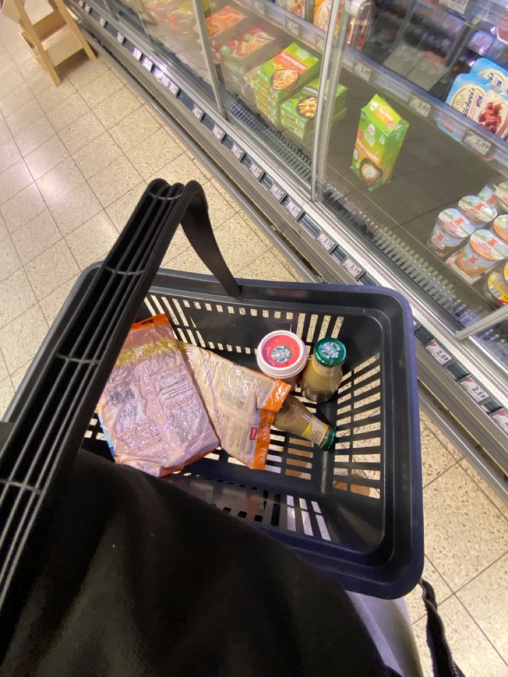 an empty shopping cart in a grocery store