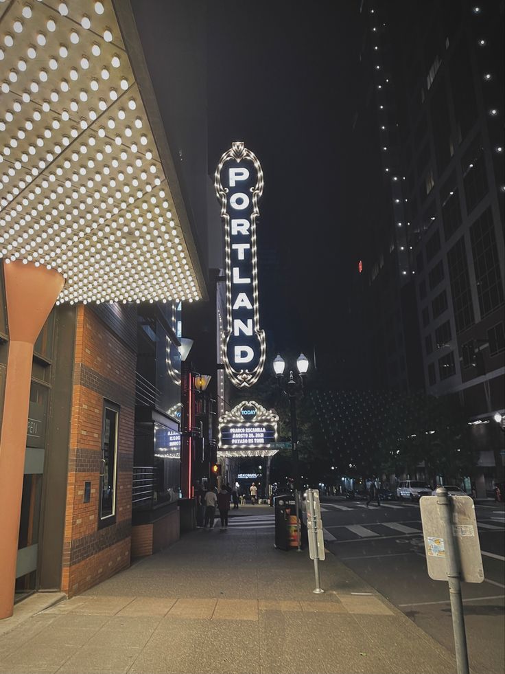 the sign for portland is lit up at night