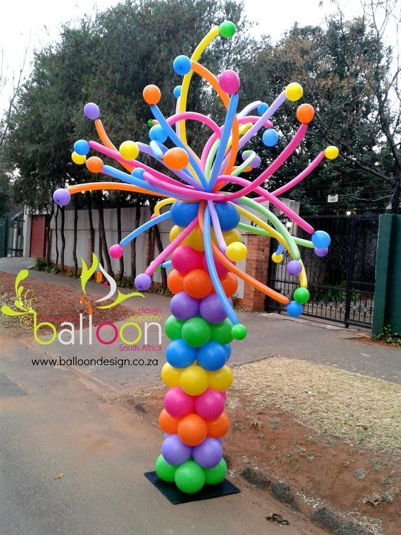 a colorful balloon sculpture in the shape of a tree