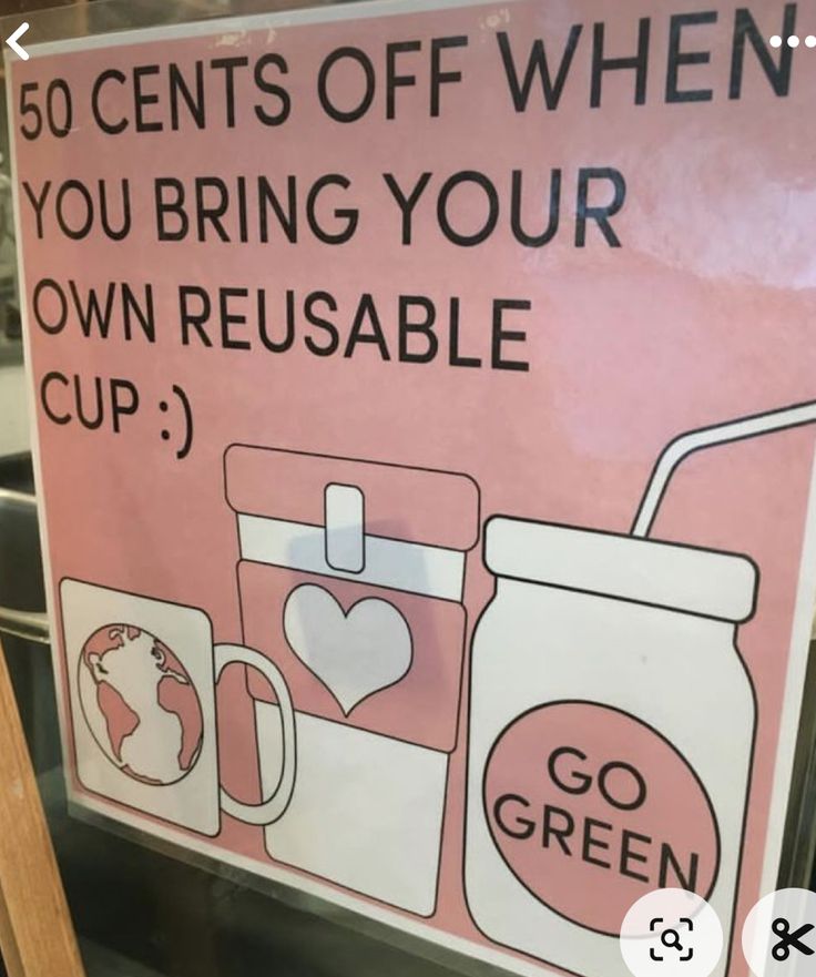 a sign that is on the side of a glass door saying, 50 cents off when you bring your own reusable cup