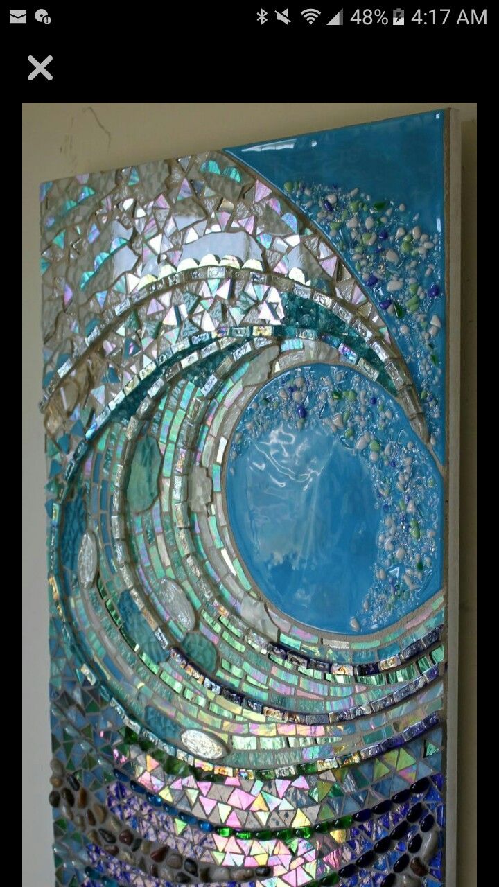 an art piece made out of glass and mosaic tiles