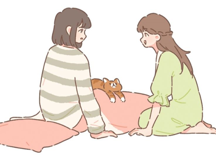 two women sitting on the floor talking to each other with a teddy bear in their lap