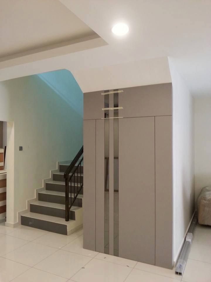 an empty living room with stairs leading up to the bedroom