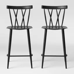 two black chairs sitting next to each other on a white background with the same chair in front of them