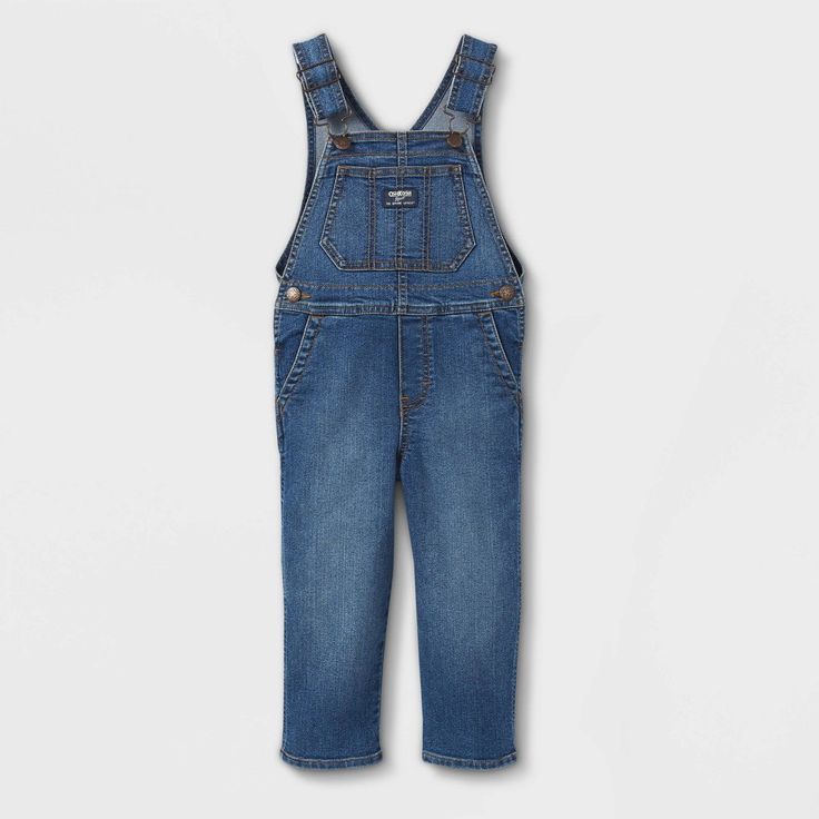 An OshKosh classic here. Whether worn for picture day, a special occasion or even his most fun play date, you can't go wrong with comfy overalls with all the great details. There's adjustable shoulder straps, an OshKosh logo patch and even stretch denim for added comfort. Then, to make it even better, you can roll and cuff the legs to highlight his individual style - even if he is still learning it! These overalls for toddler boy will not disappoint. Comfy Overalls, Khaki Overalls, Blue Jean Overalls, Toddler Vest, Overall Jumper, Toddler Overalls, Cute Overalls, Blue Overalls, Baby Boy Summer