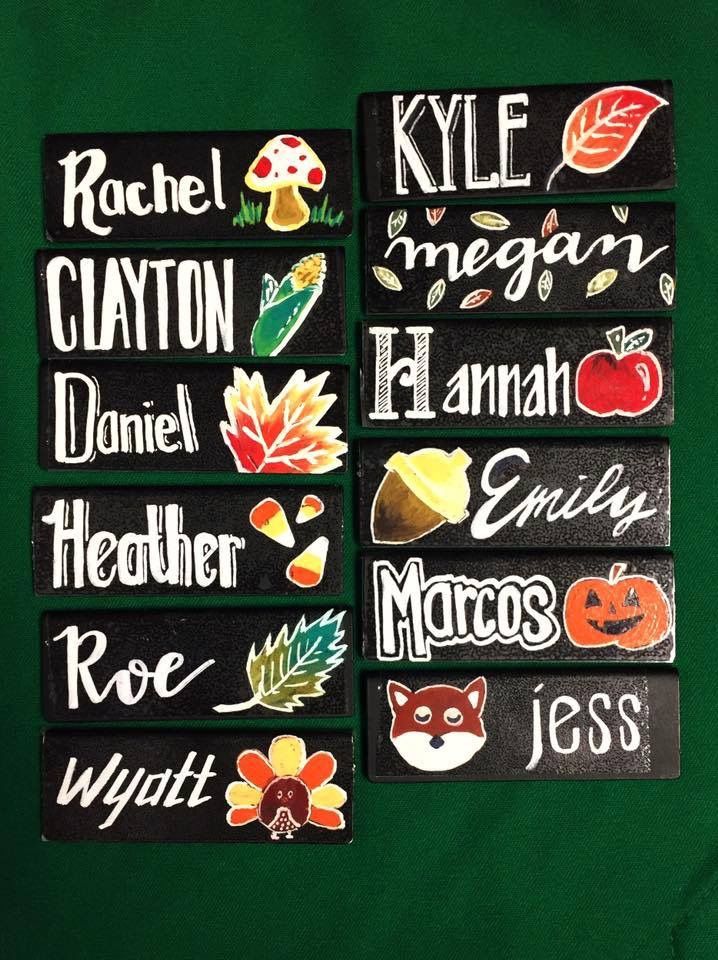 four magnets with different types of fall and thanksgiving stickers on them sitting on a green surface