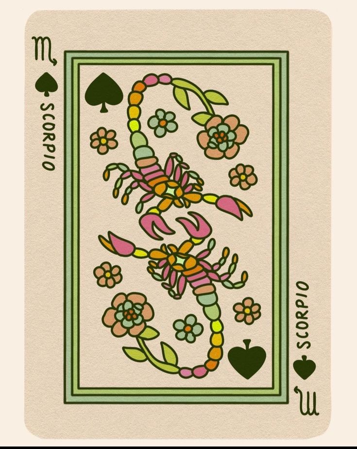 the back side of a playing card with flowers on it