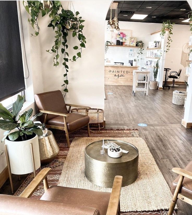 a living room filled with furniture and plants