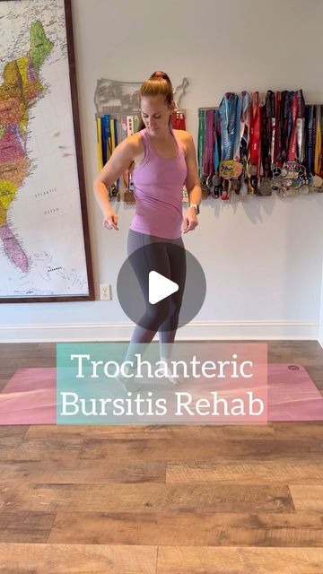 a woman standing on top of a yoga mat in front of a wall with the words trochanteric bursitiss rehab