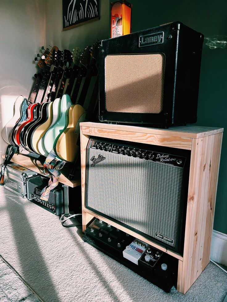 there are many guitars and amps in this room