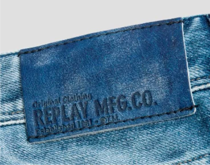 the back pocket of a pair of jeans with an embroidered label on it that reads, reteay mcgo