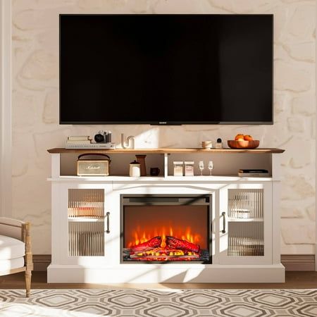 an entertainment center with a fireplace and flat screen tv mounted on it's wall