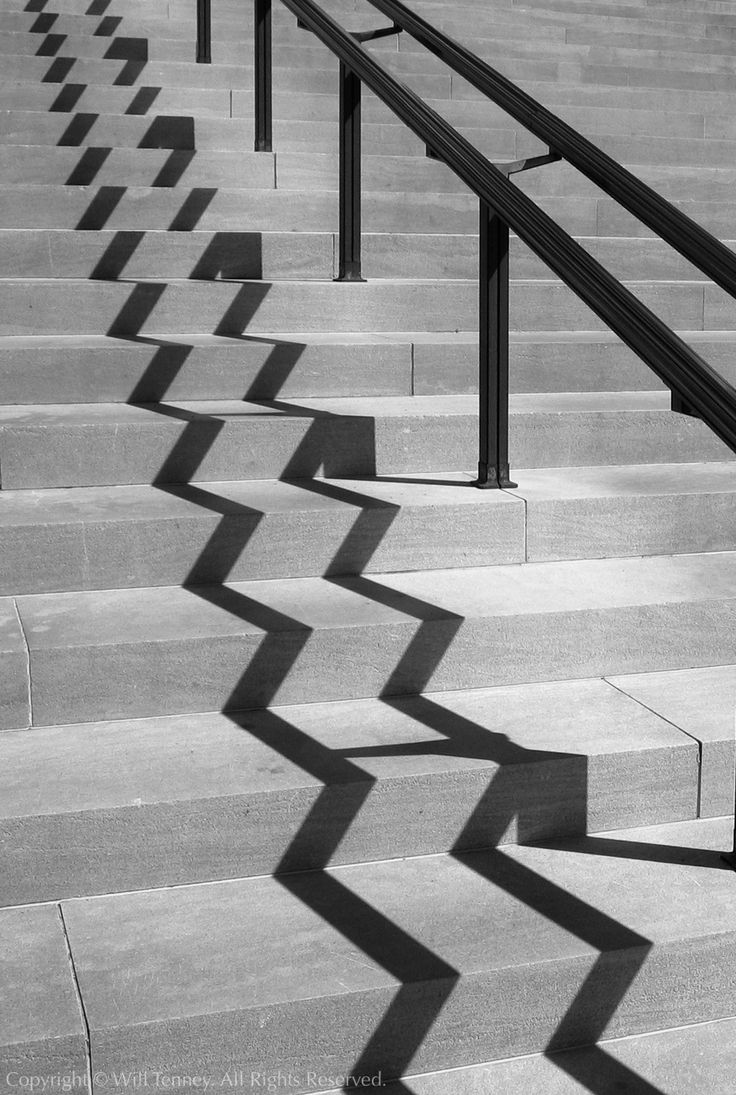 black and white photograph of stairs with railings