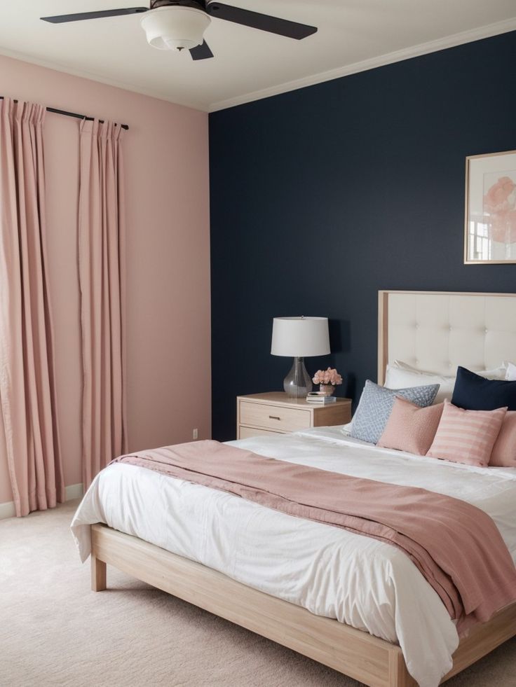 a bedroom with blue walls and pink accents