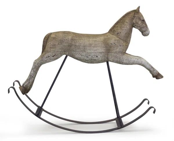 a wooden rocking horse on a white background