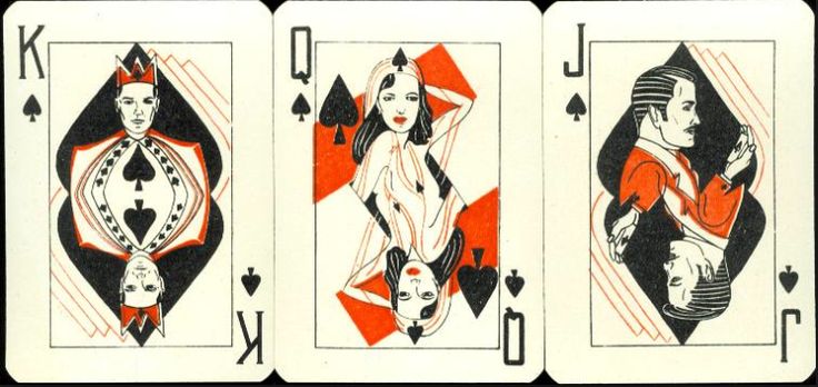 three playing cards with the same design on each card, one in red and one in black