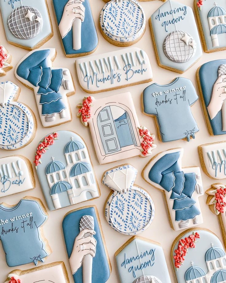 decorated cookies with blue and white designs on them