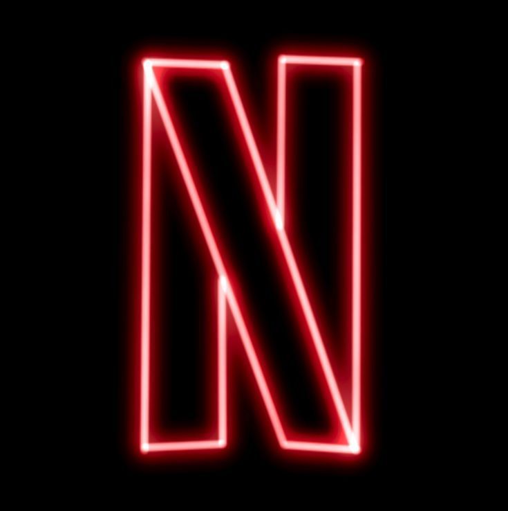 the letter n is made up of neon lights on a black background, and it appears to be red