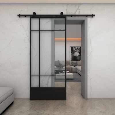 an open glass door leading into a living room