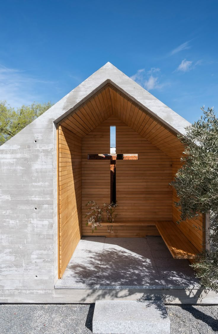 the entrance to a church with a cross on it