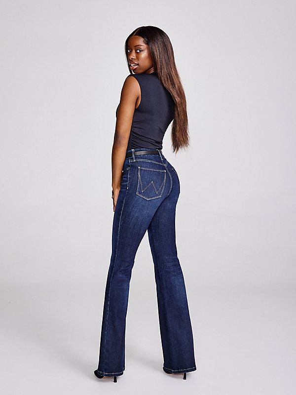 Turn up the volume and give those curves the love they deserve with our Women’s Wrangler® Bespoke High-Rise Flare Jean. We've made the vintage-inspired style even more flattering with a silhouette and angled back pockets to accentuate your shape. These new and improved bell-bottoms also come with a contoured waistband that eliminates gapping. Plus, the signature “W” pocket stitching and logo patch for an extra dose of authenticity. The Wrangler Bespoke Collection features superior stretch and de Spirit Jeans Ideas, Spirit Jeans, Wrangler Jeans Women's, Ariat Jeans, Jeans Ideas, Pocket Stitching, Woman Pants, Turn Up The Volume, Flair Jeans