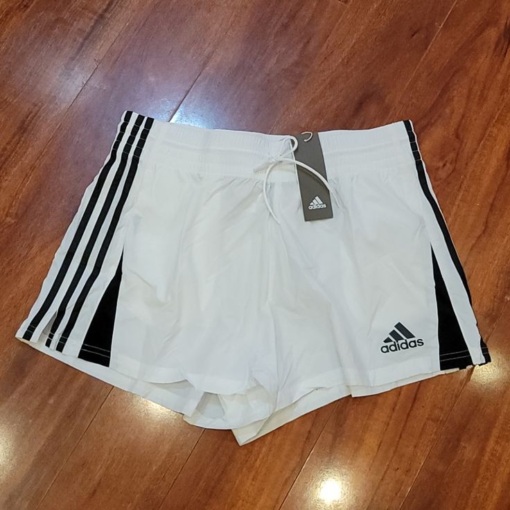 Nwt Adidas Shorts. They Have 2 Front Pockets. Material Had The Parachute/Swishy Feel. Adidas Sporty White Athletic Shorts, White Adidas Sports Shorts, Adidas White Athletic Shorts With Built-in Shorts, Adidas White Sports Shorts, Adidas White Bottoms With Built-in Shorts, Adidas White Summer Bottoms, Adidas White Sporty Shorts, White Adidas Bottoms For Summer, Adidas White Casual Shorts