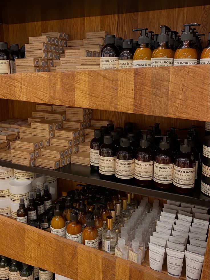 the shelves are filled with many different types of bottles