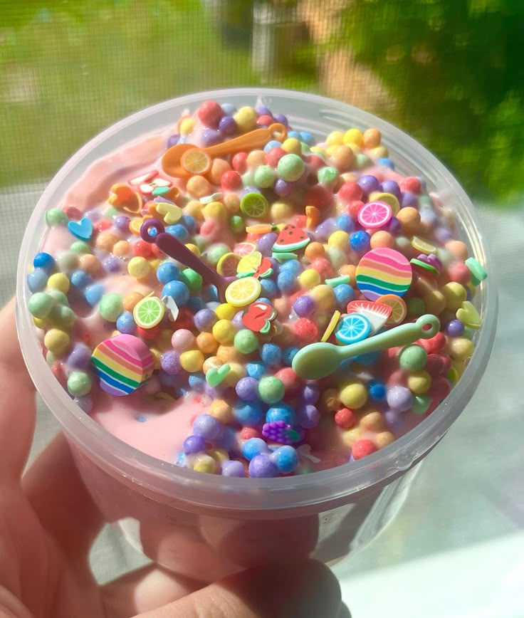 a plastic container filled with lots of candy