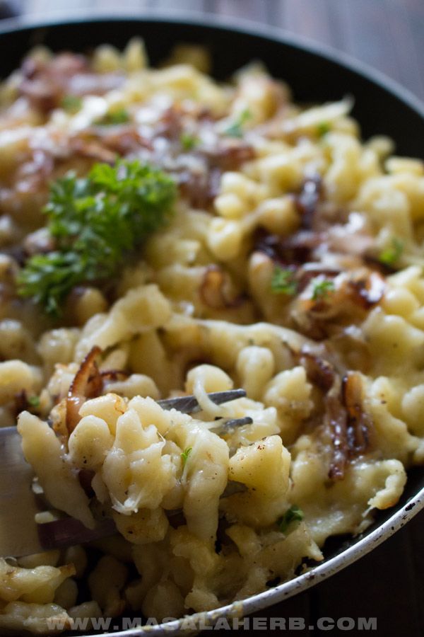 a close up of a plate of food with pasta and broccoli on it