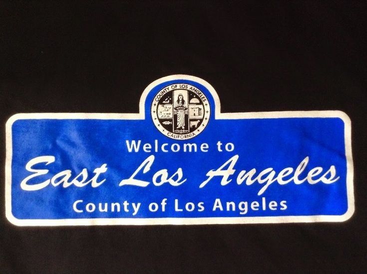 a blue and white sign that says, welcome to east los angeles county of los angeles