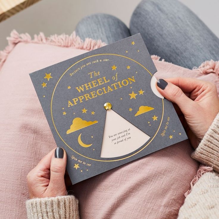 the wheel of appreciation book is held up in front of a woman's stomach