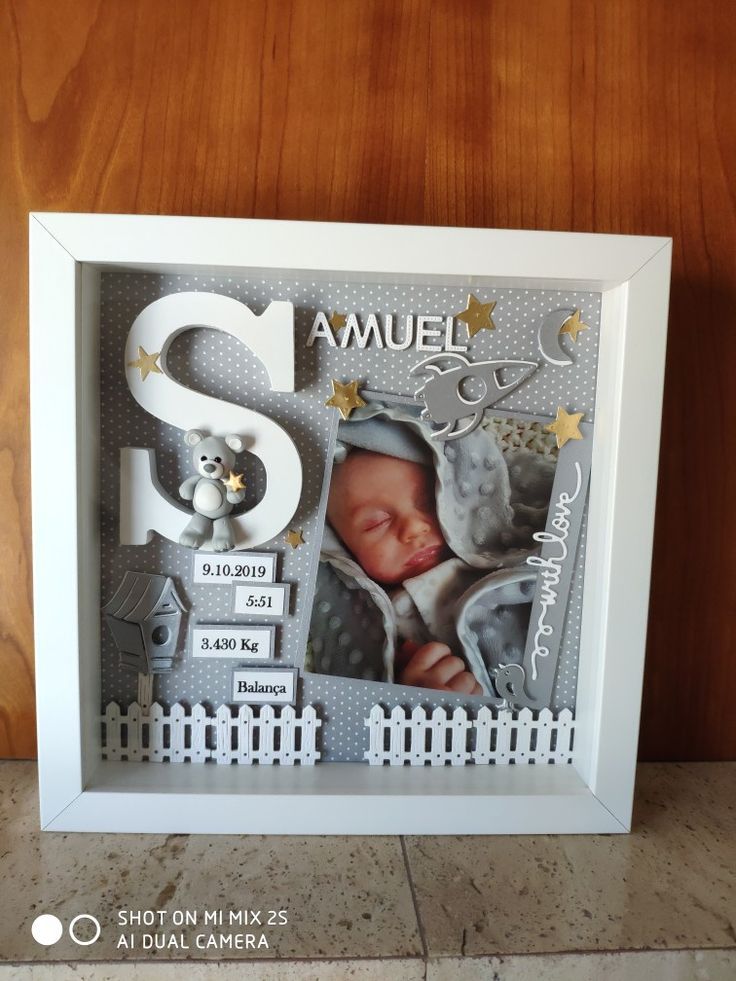 a baby's first year photo frame with the number six and an image of a teddy bear