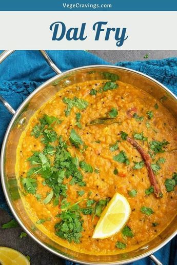 a large pan filled with dalfry and garnished with cilantro