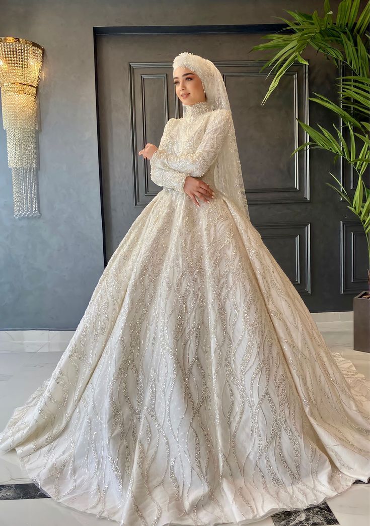 a woman in a white gown and veil