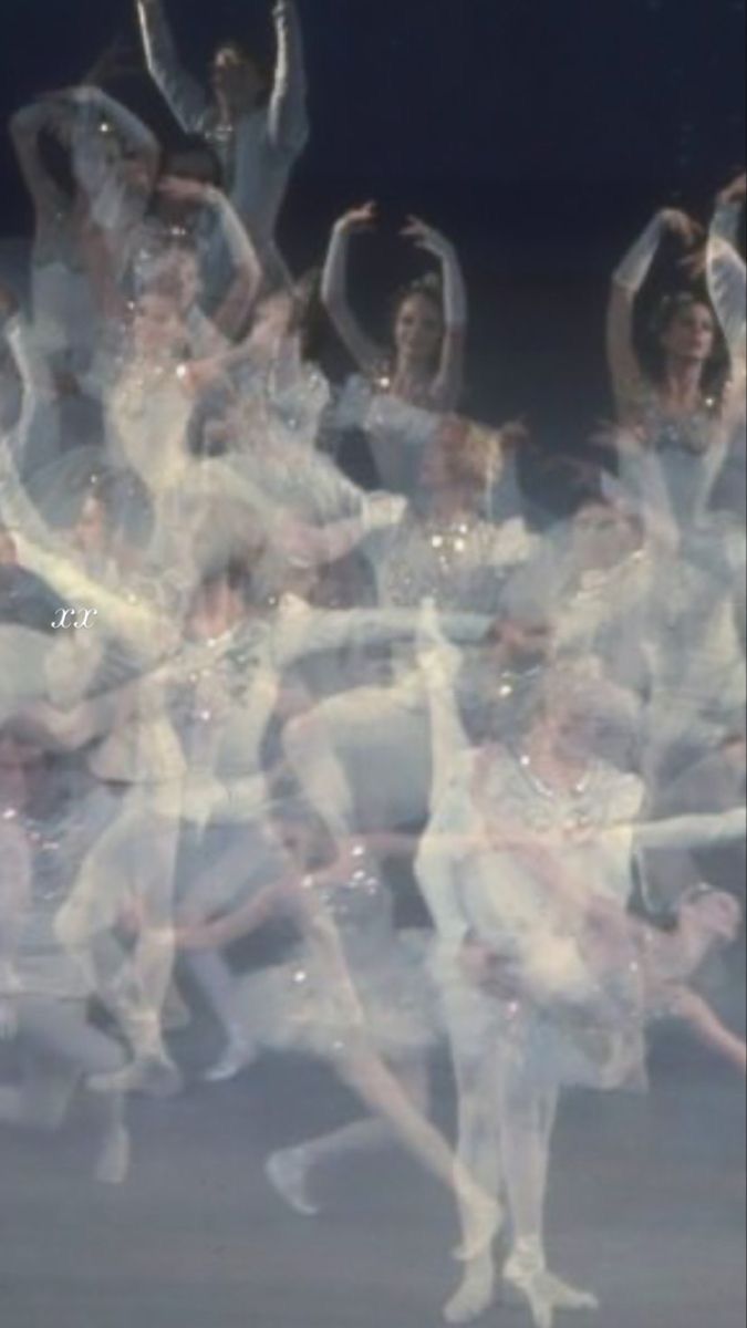 a large group of ballet dancers in white outfits