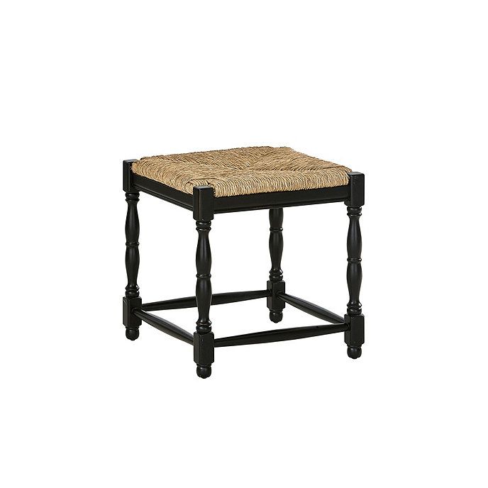 a black stool with a woven seat cushion