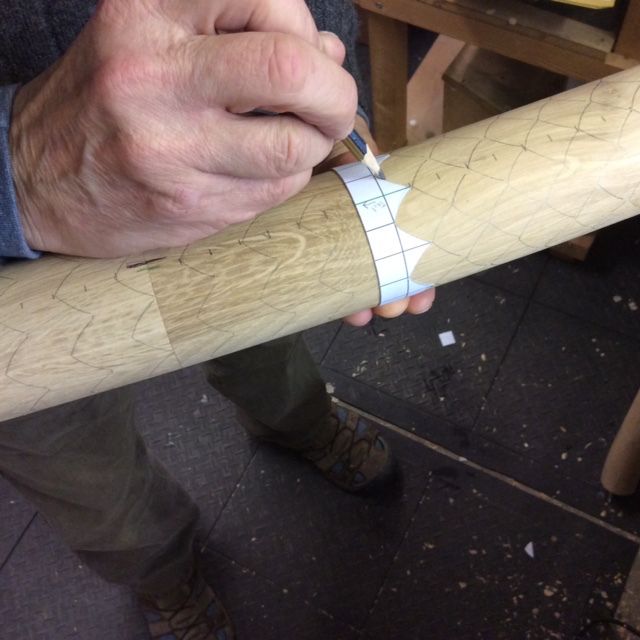 a man holding a baseball bat with tape on it