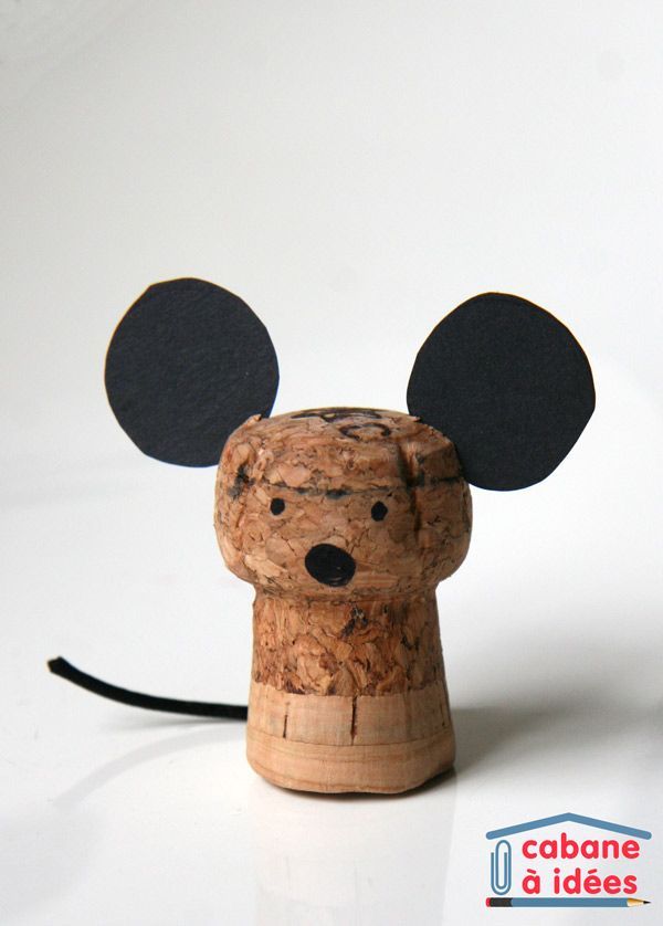 a cork mouse head with two ears on it