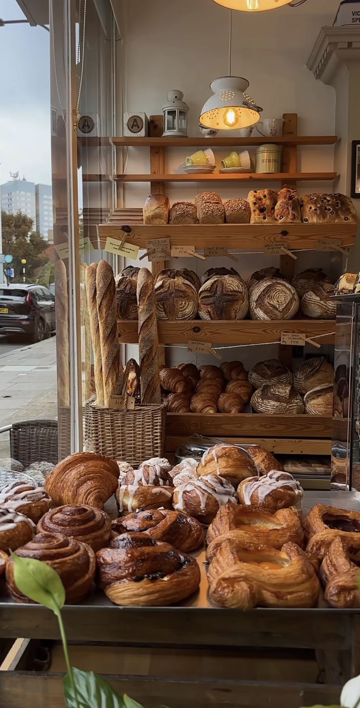 an assortment of breads and pastries on display