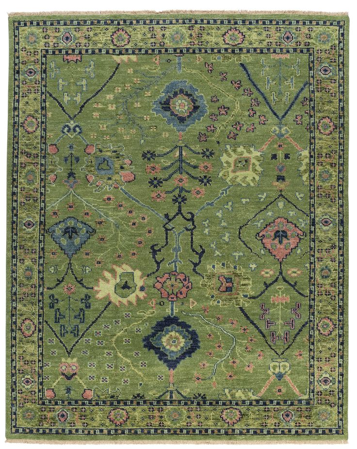 a green rug with an ornate design on it