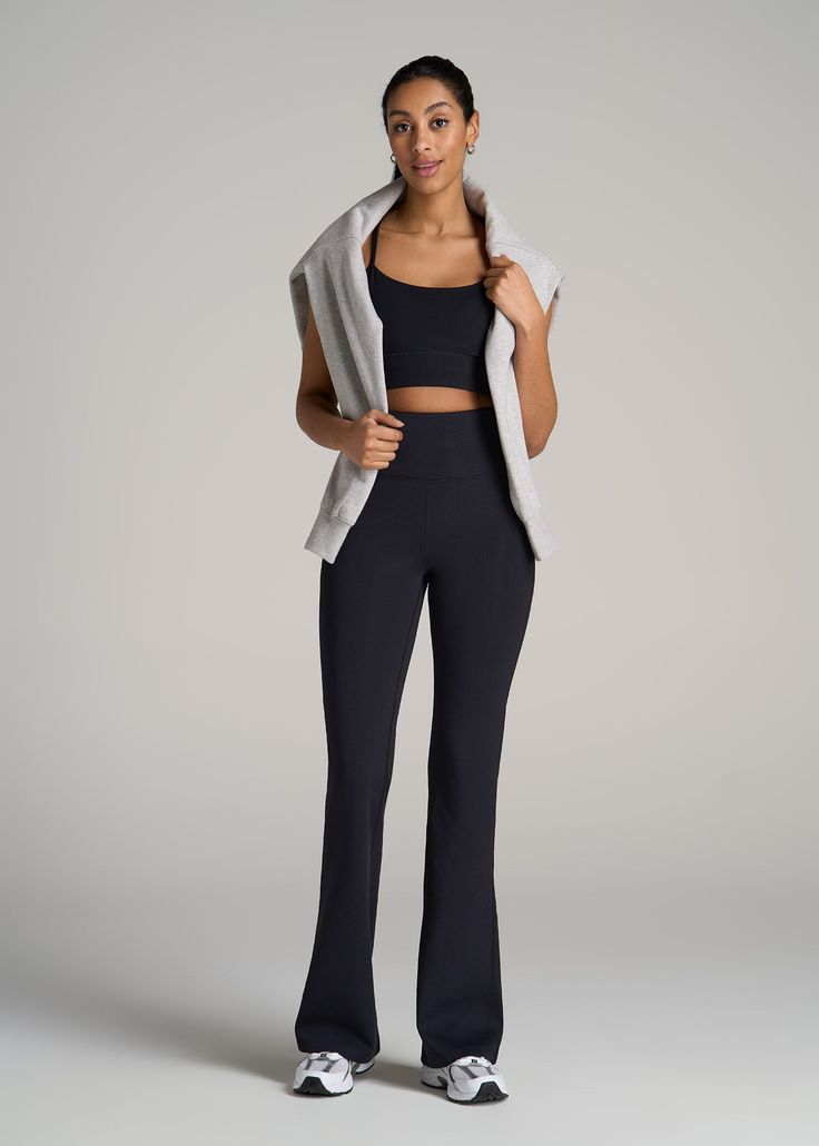 About Our Extra-Long Yoga Pants The women's tall yoga pants you've been dreaming of are finally here. For years, vertically blessed ladies haven't been able to rock this timeless athleisure style, having to deal with flared bottoms that ended awkwardly above the ankle or fits that were far too baggy. Not anymore. You can finally own the extra-long yoga pants of your dreams with this new pair from our Balance collection designed exclusively for women 5'9” to 6'6”. The full length will sit just ab Wide Leg Athleisure Activewear For Relaxation, Black Straight Leg Sweatpants For Yoga, Athleisure Yoga Activewear Straight Pants, Black Athleisure Bottoms For Relaxation, Athleisure High-waisted Yoga Pants, Black Full-length Yoga Pants For Relaxation, High-waisted Athleisure Yoga Pants, High-waisted Yoga Pants In Athleisure Style, Black Pants For Relaxation