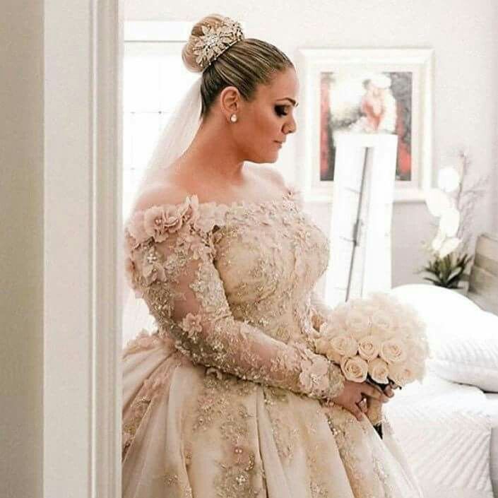 a woman in a wedding dress holding a bouquet