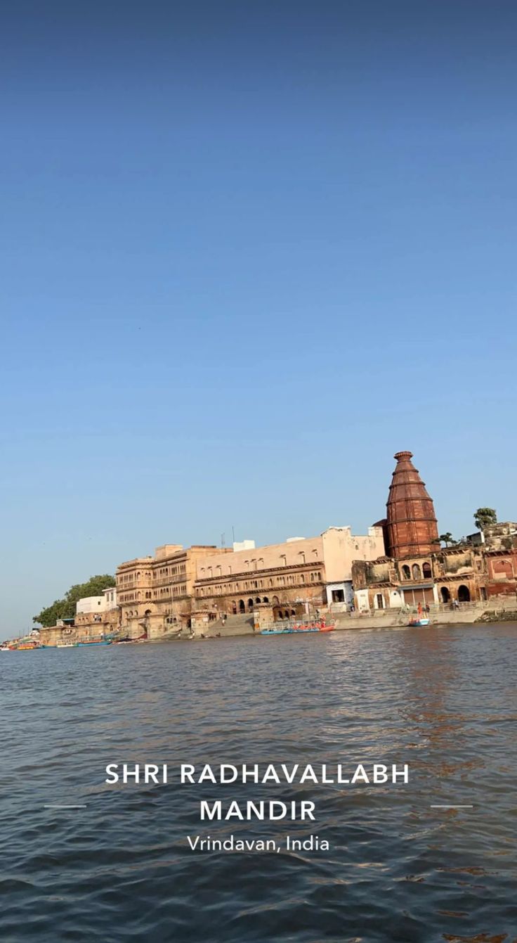 an image of some buildings in the middle of water with blue skies above it and text that reads shri radnavallabh mandir